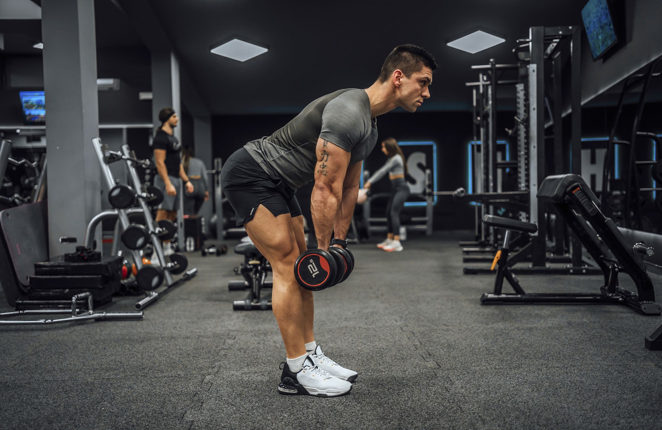 young-man-training-in-the-gym-royalty-free-image-1692639823